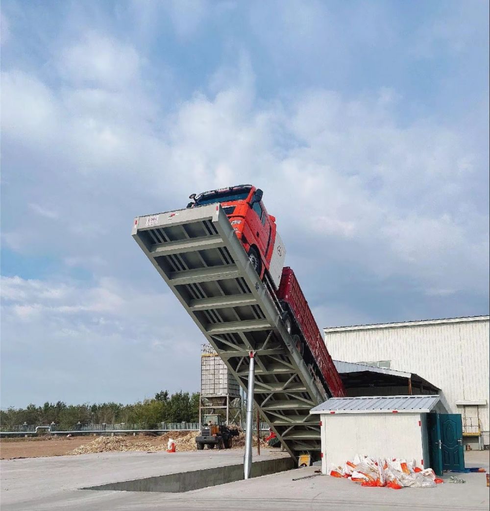 液壓卸車機(jī)、后翻式液壓翻板卸車平臺(tái)、河南愛信液壓翻板機(jī)